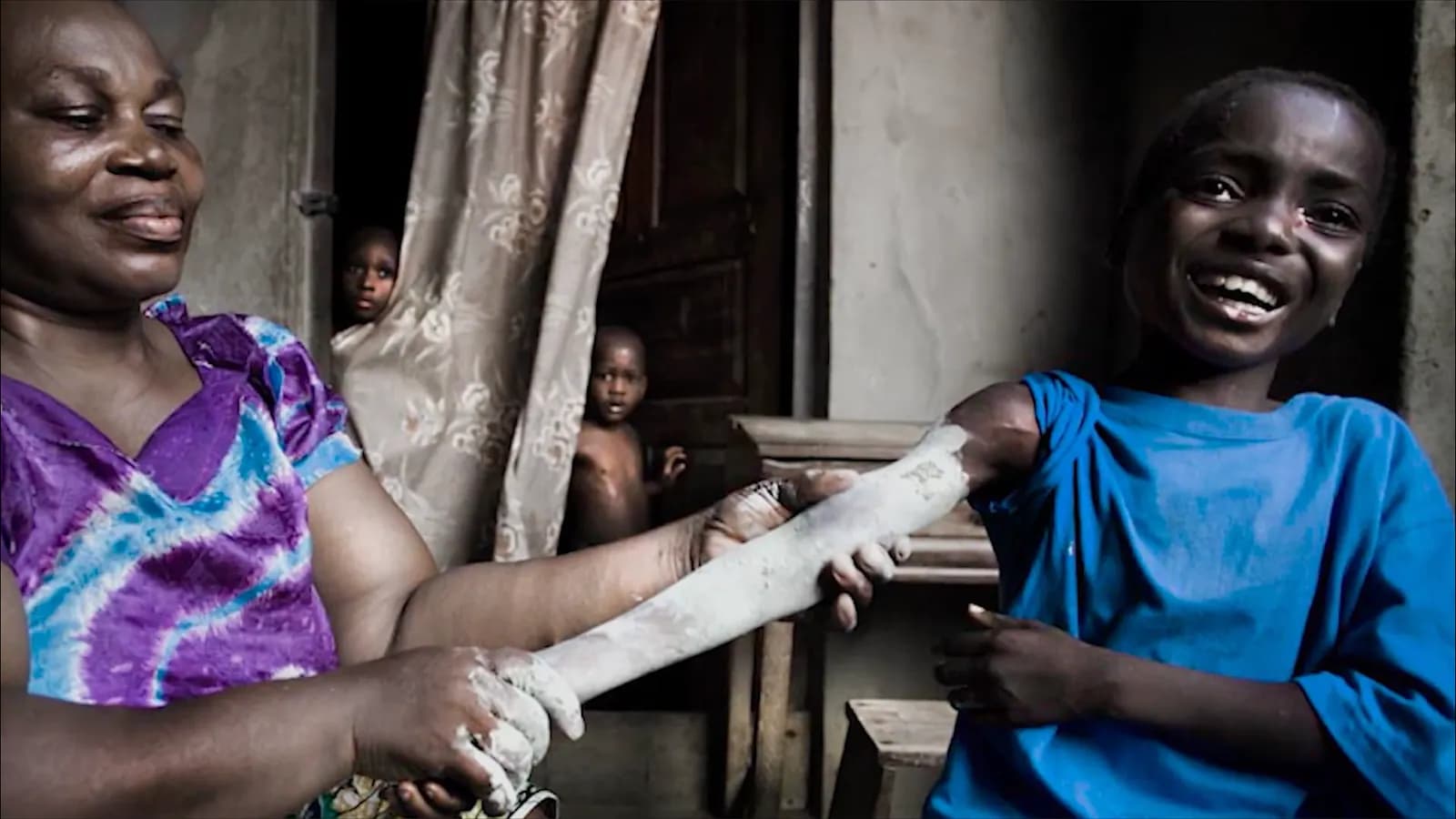 A nurse treating Etido's broken arm